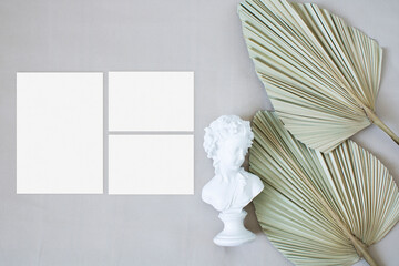 Wedding suite mockup with leaf palm and the statue on the nude fabric