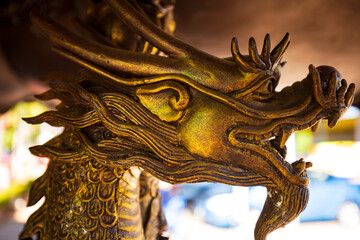 The forged figure of a winged dragon sculpture At worship of temple thailand.