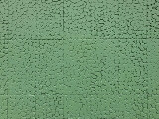 Smooth green walls with beautiful patterns used to decorate the building.