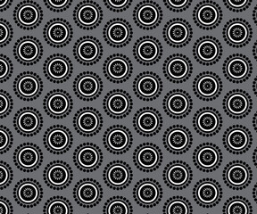 black and white circle  pattern on gray background.