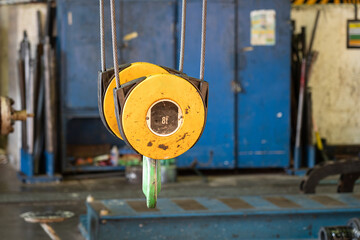 Electrical overhead crane hook and cable hoisting part which is using to lifting heavy object at...