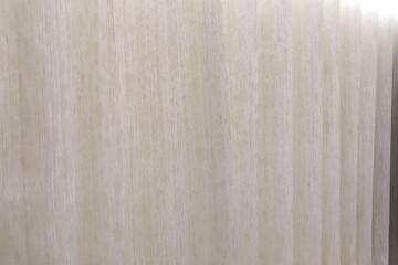 background photo of ivory white color curtain in the luxury bedroom of the hotel