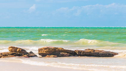 Fototapeta na wymiar Beautiful Holbox island beach sandbank boulders turquoise water waves Mexico.