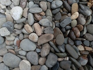 abstract background with round pebble stones. Vacation holiday recreation on beach concept.