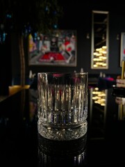 empty glass in a dark bar