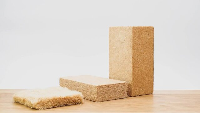 buildings thermal insulation natural fibers blanket samples on a wooden worktop