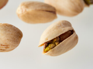Pistachios isolated on a white background, top view. Flat lay