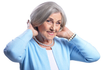 Smiling beautiful senior woman posing on white background