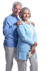 happy senior couple embracing and posing on white background