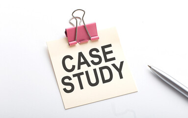 CASE STUDY text on sticker with pen on the white background