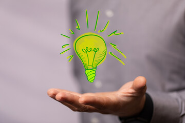 hand holding eco light bulb energy concept