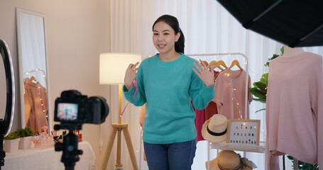 Asia SME owner or seller woman micro influencer record live talk video camera at home studio. Happy...