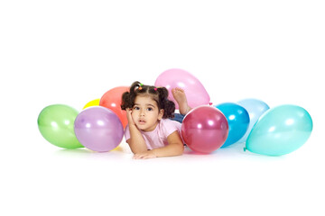 Fototapeta na wymiar Portrait of young girl with balloons on a white background