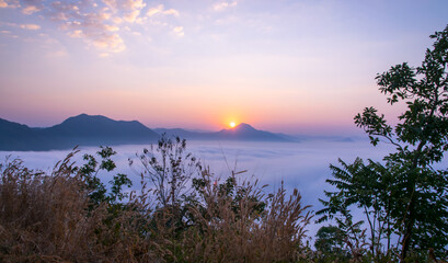 Fototapeta na wymiar sea of fog over the mountain. Beautiful dramatic view.