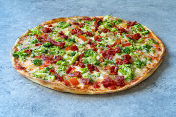 Vegetarian Pizza with Broccoli and Dried Tomatoes.