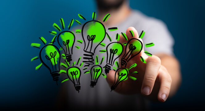 Hands holding green nature in the light bulb