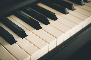 Photo of selective focus on piano keyboard use for instrument musical concept.