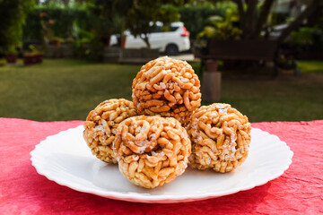 Murmura ladoo laddu puffed rice ball Indian festival food sweet snack for Lohri Makar sankranti Pongal Diwali. Winter season food from India