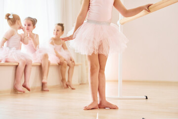 Practicing dance moves. Little ballerinas preparing for performance