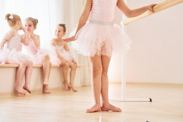 Practicing dance moves. Little ballerinas preparing for performance © standret