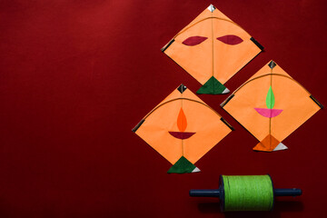 Kites and spool on red background. Makar sankranti Indian festival posters for Uttarayan, Lohri and Pongal. Kite festival. Patang aur Manjha