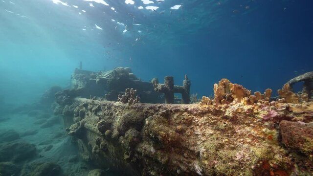 Seascape with Tugboat Wreck in the coral reef of Caribbean Sea, Curacao