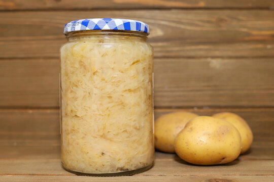 A Jar Of Sauerkraut On A Wooden Table