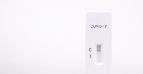COVID-19 (SARS-CoV-2) rapid antigen test kit (Colloidal gold), for self-testing, with negative result. Copy space on white background.