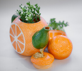 Ceramic teapot handmade orange with a gold leaf