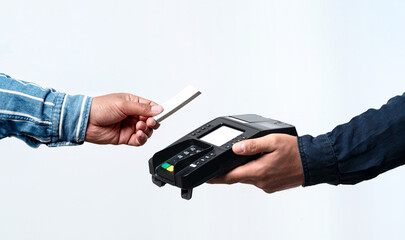 Hands holding pos device and credit card on isolated white background. Contactless and easy payment concept.