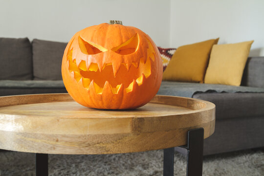 Carved Halloween pumpkin, jack lantern (Jack-o'-lantern). Spooky laughing, scary head.