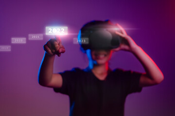 Metaverse and Blockchain Technology Concepts. Person Enjoying an Experiences of metaverse virtual digital technology game control with VR glasses, GameFi, 2022