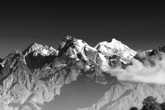 From left - Mount South Kabru (24215 feet), Mount North Kabru and Mount Talung (24200 feet) - beautiful view of great Himalayan mountains at Ravangla, Sikkim. Black and white image.