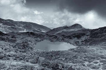 Top view of Kalapokhri lake, Sikkim, Himalayan mountain range, Sikkim - It is one of beautiful remote placed lakes of Sikkim. Black and white image with blue tint.
