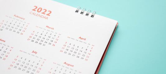 2022 calendar page on blue background business planning appointment meeting concept