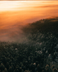 Obraz premium sunrise over snow covered mountains near hohe wand in austria