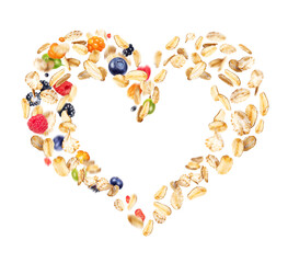 Oat flakes with wild berries in the shape of a heart