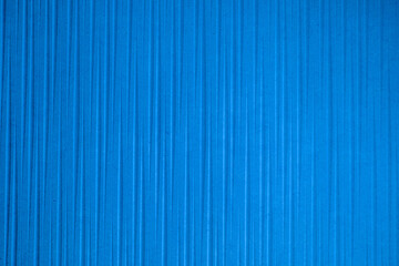 Obraz premium Blue wall with striped decoration ideal for textures and patterns