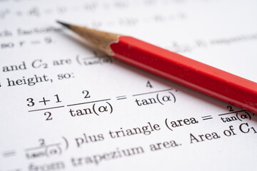 Pencil on mathematic formula exercise test paper in education school.