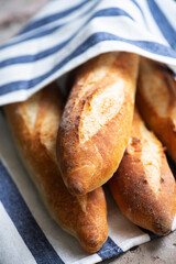Batch of freshly baked baguettes background.