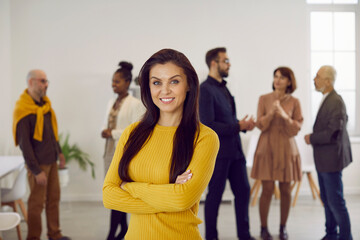 Portrait of successful young businesswoman pose in office show leadership and confidence. Profile picture of smiling woman employee or worker forefront at workplace. Business leader or ceo. - obrazy, fototapety, plakaty