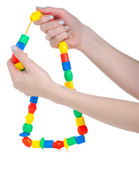 kids toy beads in hand on white background isolation