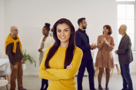 Portrait of successful young businesswoman pose in office show leadership and confidence. Profile picture of smiling woman employee or worker forefront at workplace. Business leader or ceo.