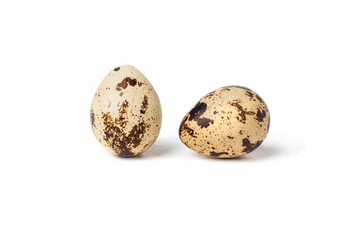 Obraz premium Two quail eggs on a white background. Close-up