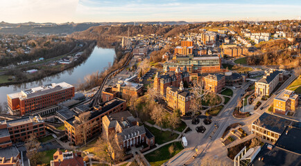 Aerial drone panoramic shot of the downtown campus of WVU in Morgantown West Virginia showing the...