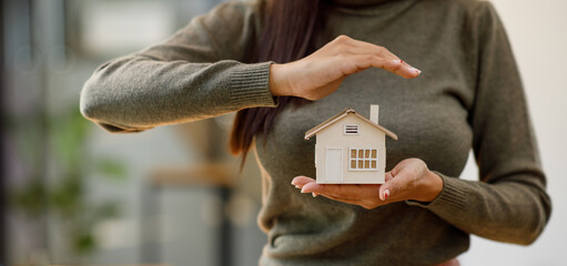 hands holding modern house, family home, homeless shelter and real estate, housing and mortgage crisis, foster home care, family day care, social distancing