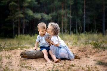 Little girl kissing boy in the face