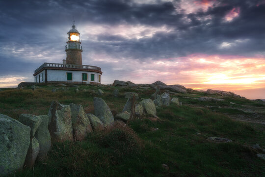 Moody image of a lighthouse at sunset