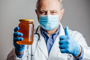 Nutritionist recommending organic honey to his patients
