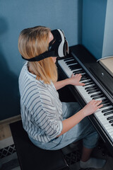 Virtual reality. The girl studies the game on the phono with glasses VR.  metaverse, digital world, immersive project. The virtual world VR , interactive at home.Metaverse home,Immersive experience